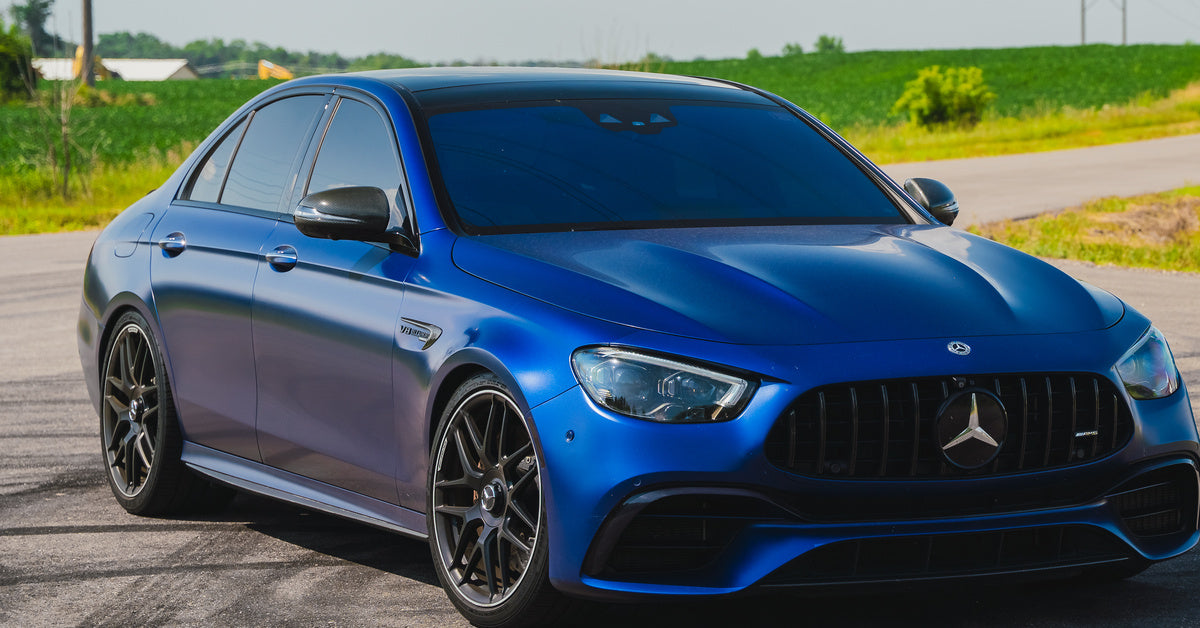 Blue Mercedes-AMG sedan photographed outdoors